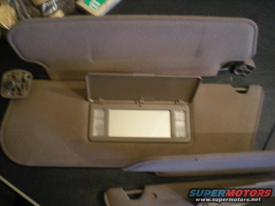 Tan interior sun visors with illuminated vanity mirrors