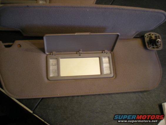 Car visor with vanity mirror and lights, another visor above