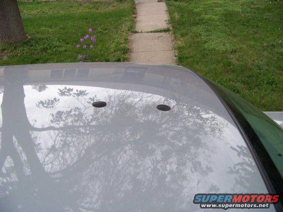 The trunk lid has the holes for the antenna farm... 

There was a dent on the lid when I bought it, and once the paint started to peel off, I replaced the whole trunk lid with one from a 2008 car in the same color.