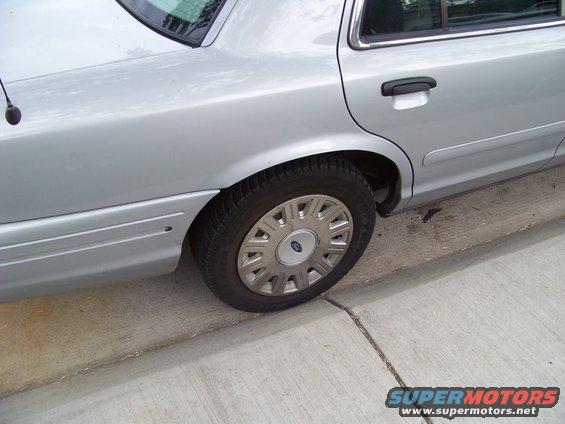 Stock hubcaps over the steel wheels.
