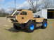 1992 Ford Bronco - This custom vehicle appears to be a homemade construction with a cardboard exterior and distinctive blue wheels.