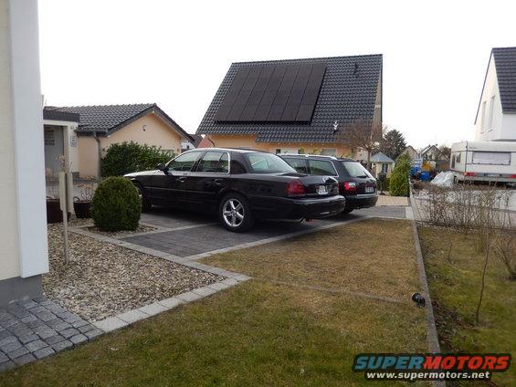 Black 2003 Mercury Marauder parked on driveway, side view