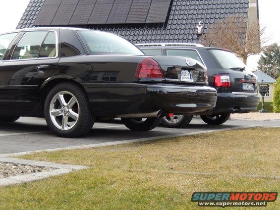 Rear view of black 2003 Mercury Marauder parked next to an Audi wagon