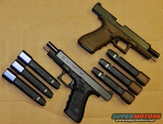 Two Glock pistols with magazines laid out on a brown surface