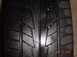 1999 Ford Mustang - A close-up view of a tire tread, showing the pattern and some wear.