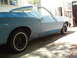 1973 Ford Ranchero - Side profile of a blue 1973 Ford Ranchero with black wheels and whitewall tires.