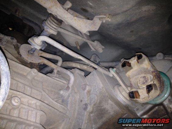 Underbody view of vehicle transmission and linkage components