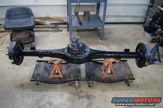 black rear axle assembly on jack stands