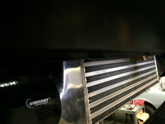 Intercooler and black hose with Vibrant Performance logo