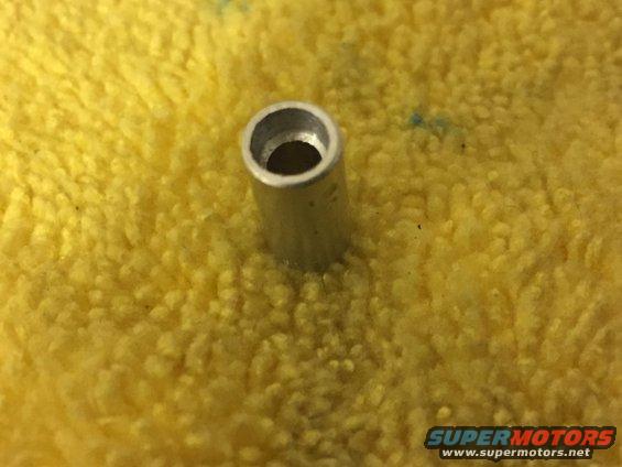 Metal tube on yellow fabric with Supermotors logo