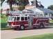 1996 Ford Crown Victoria - Side view of a Toledo Fire & Rescue ladder truck with the number 141 visible.