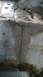 1994 Ford Bronco - A close-up view of a damaged concrete structure with significant cracking.