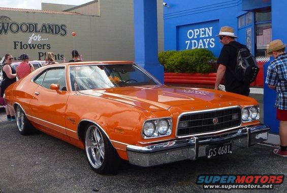Orange 1972 Ford Gran Torino coupe front 3/4 view