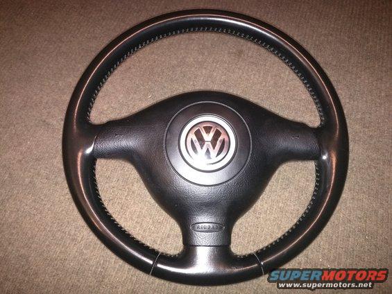 Black steering wheel with Volkswagen logo and AIRBAG text