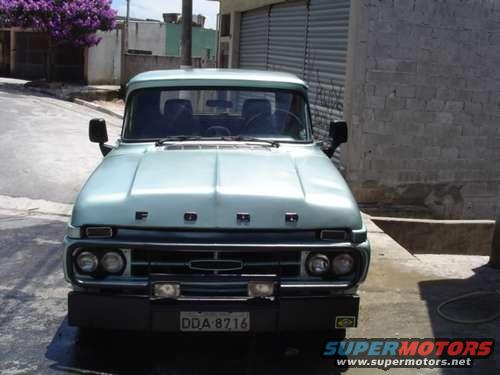 Front view of a light blue 1967 Ford F-Series truck. License plate DDA-8716