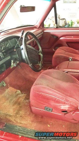 Red interior with cloth seats and steering wheel. 1994 Bronco