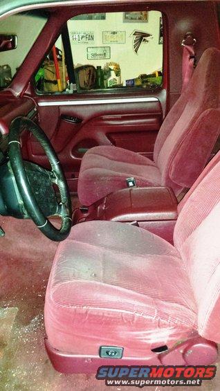 Red velour seats and dashboard of a 1995 Ford Bronco interior