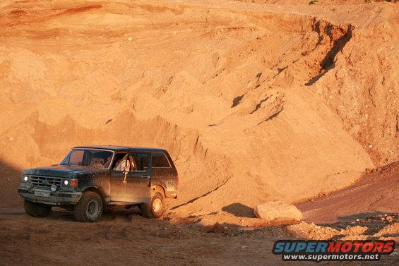 1987 Ford Bronco 3q-front view driving on sand