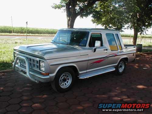 1970 Ford F-100 pickup truck with a bull bar and custom side graphics