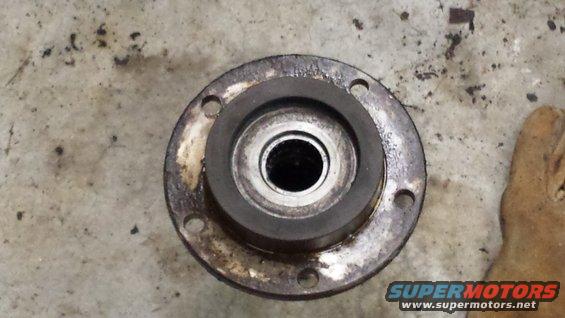 Wheel hub assembly with four bolt holes and a central bearing race