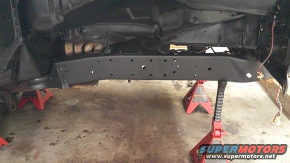 1978 Ford Bronco underbody on jack stands, showing frame and exhaust