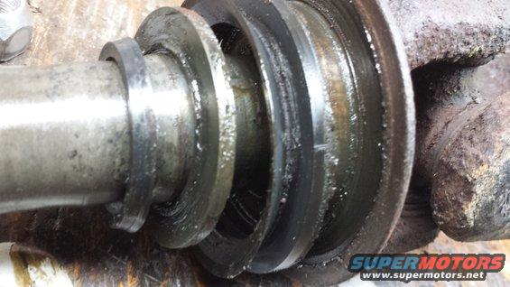 Worn metal shaft with seals and grease
