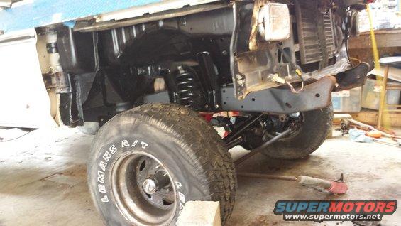 1978 Ford Bronco front wheel and suspension, undergoing repair