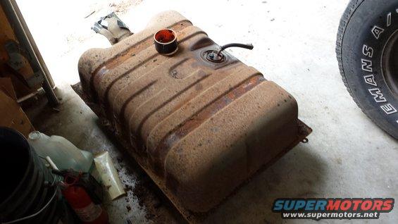 Rusted vehicle fuel tank with filler neck and fuel line attached