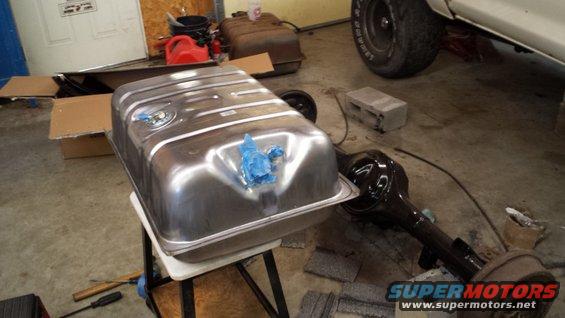 Polished fuel tank and rear axle assembly in a garage