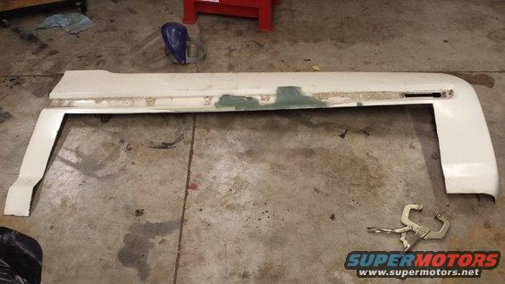 White car fender part on concrete floor