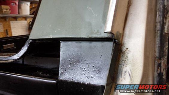 Black metal trim and gray painted panel in vehicle interior corner