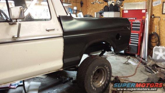 1978 Ford Bronco side view, white and black paint, in garage