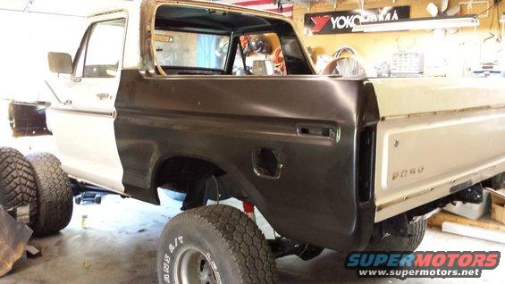 1978 Ford Bronco rear quarter panel and tailgate area with primer applied