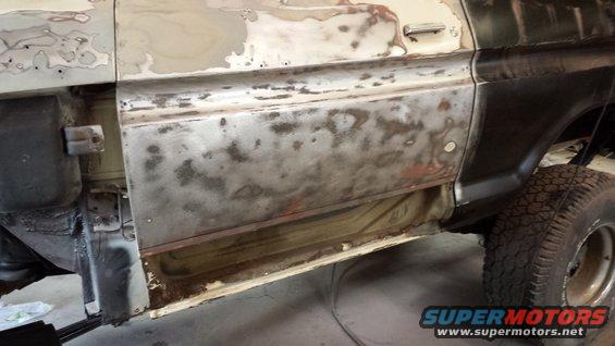 1978 Ford Bronco side panel with rust and primer