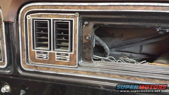 1978 Ford Bronco interior dashboard air vents and controls with wood grain trim