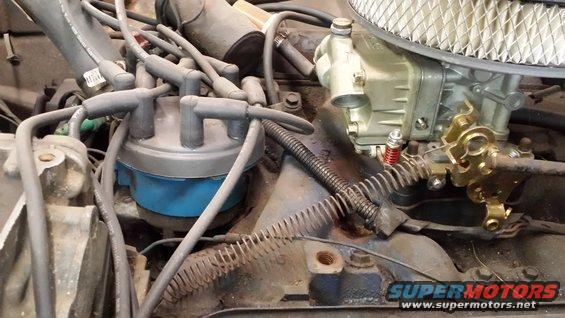 Close-up of engine distributor cap and carburetor