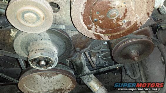 Engine pulleys and belts, heavily corroded and dusty