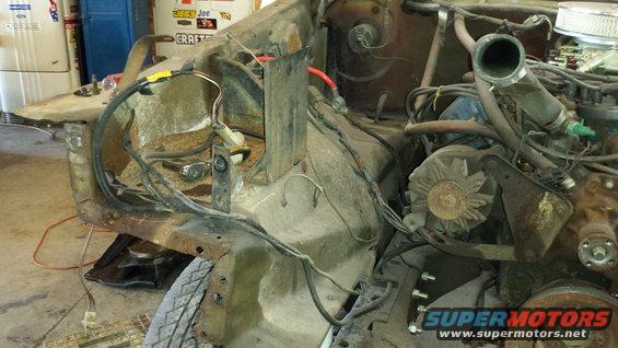 1978 Ford Bronco engine bay with exposed wiring and engine components