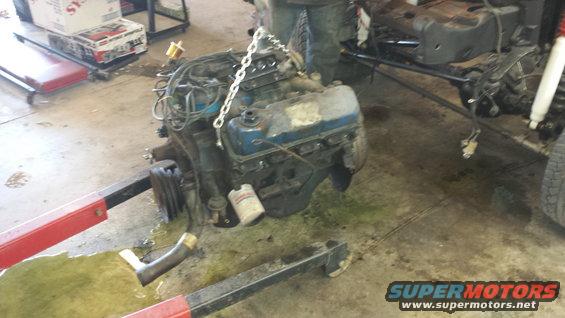 Engine on hoist, blue valve covers