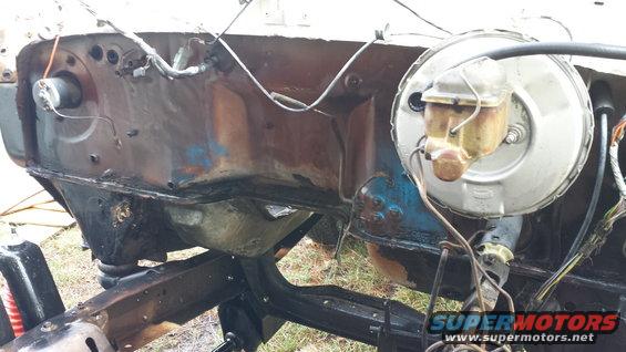 Engine bay firewall and brake booster assembly