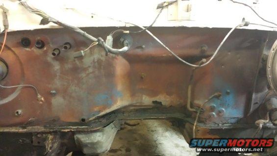 Engine bay firewall with rust and wiring
