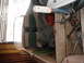 1963 Lund WC 14 - Interior view of a boat showing seats, gear, and part of an outboard motor.