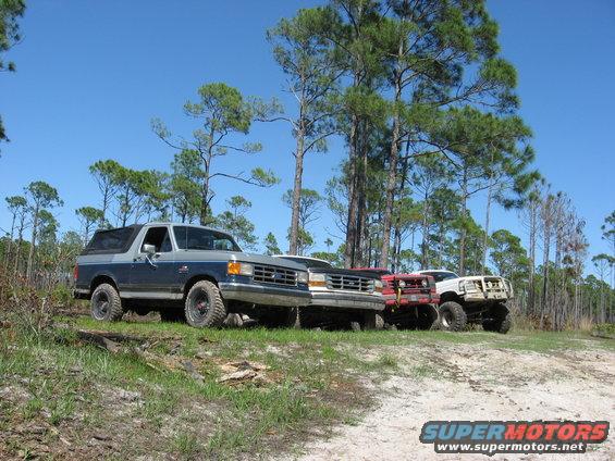 1994 Ford Bronco parked with three other off-road vehicles