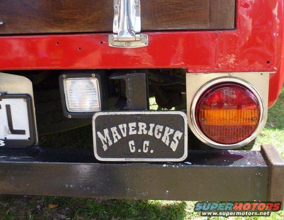 Rear bumper with a 'MAVERICKS C.C.' plate, a square auxiliary light, and a round taillight