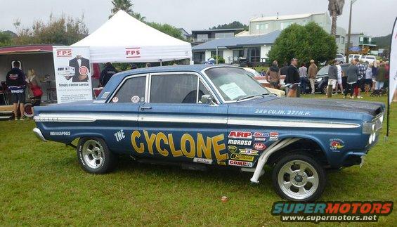Blue 1963 Ford Falcon coupe with yellow 'The Cyclone' lettering and racing decals