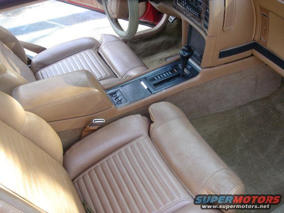 Tan interior of 1991 Buick Reatta with bucket seats and center console