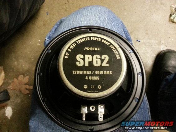 Speaker with "PROFILE SP62 6.5" 2-WAY TREATED PAPER CONE SPEAKERS 120W MAX / 40W RMS 4 OHMS" text, held over jeans