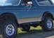 1990 Ford Bronco - Side view of a 1990 Ford Bronco, showing its body lines and BFGoodrich All-Terrain tires.