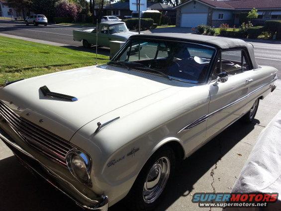 1963 Ford Falcon convertible parked on driveway, another truck in background