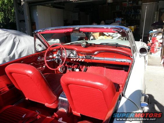 1963 Ford Falcon convertible interior with red seats and dashboard